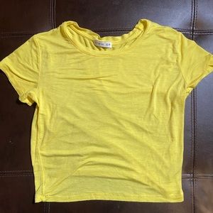 yellow cropped shirt